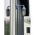 Industrial Guard Sconce, 715-Delphite Blue PTMP, CGG-STandard Cast Guard in 975-Galvanized, Frosted Glass, 2700K Color Temp | Photo Courtesy of Studio Baron