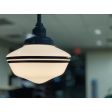 Primary LED Schoolhouse Stem Mount Light, 105-Textured Black, Large Opaque Glass, 24” Stem, Double Painted Band in 100-Black, 1250 Lumen LED, 2700K Color Temperature | Photo Courtesy of Ampersand Ice Cream