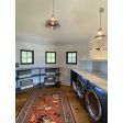(2) Sydney LED Pendants, (1) 12” & (1) 18”, both in 975-Galvanized Shade, Both With Cap, Both with CSBB-Black & Brown Chevron Cloth Cord, 18” with 400-Barn Red Guard Finish, 12” with 975-Galvanized Guard Finish  | Photo Courtesy of Island Interiors LLC