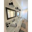 12" Laramie Sconce, 106-Matte Black | Photo Courtesy of Homeowner