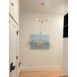 Downtown Minimalist 3-Light Chandelier, 495-Sherbet Orange, 24" Stem, Porcelain II LED Tala Lamp | Photo Courtesy of Homeowner