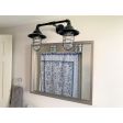 Double Market Industrial Guard Sconce, 100-Black, Flared Wire Guard, Clear Glass | Photo Courtesy of Homeowner