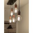 Downtown Minimalist Wooden Socket 5-Light Pendant, Oak, Black and White Cord, 106-Matte Black, G30 Bulb | Photo Courtesy of John Colenari