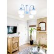Primary 4-Light Schoolhouse Chandelier, Small Opaque , 715-Delphite Blue, 12" Stem, 3 Painted Bands, 715-Delphite Blue | Photo Courtesy of Sara McDaniel of Simply Southern Cottage and Hector Sanchez Photography