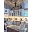 Primary Schoolhouse 2-Light Chandelier, Small Opaque, 615-Oil-Rubbed Bronze Finish, 12” Mounting Arms, 6" Stem, Standard Beehive Canopy, Triple Painted Bands in 715-Delphite Blue | Photo Courtesy of Homeowner