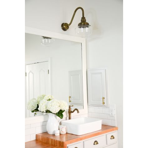 Primary Schoolhouse Gooseneck Light, 998-Natural Weathered Brass, Small Clear Glass, No Painted Band, G11 Gooseneck Arm, Brass Backing Plate & Hex Cover | Photo Courtesy of Celebrity Style Guide