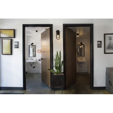 Industrial Guard Sconce, 100-Black Finish, NS-No Shade, CGG-Standard Cast Guard, CLR-Clear Glass | Photo Courtesy of Ulele Restaurant (Tampa, FL)