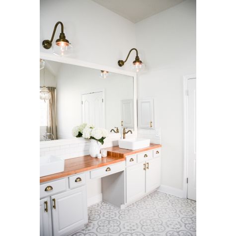 Primary Schoolhouse Gooseneck Light, 998-Natural Weathered Brass, Small Clear Glass, No Painted Band, G11 Gooseneck Arm, Brass Backing Plate & Hex Cover | Photo Courtesy of Celebrity Style Guide