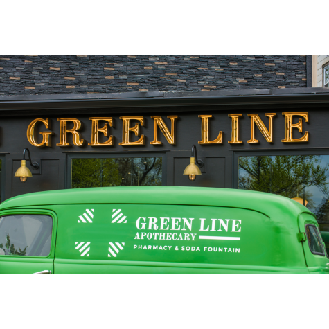 (2) 10” Wilcox, 997-Natural Raw Brass, G15 Gooseneck Arm in 100-Black, Cast Guard in 100-Black with Clear Glass | Photo Courtesy of Green Line Apothecary and Lineage Corporation