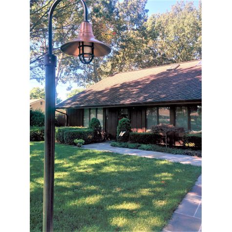 14" Aero, 996-Weathered Copper, Single Post Mount, 100-Black, 8’ Smooth Direct Burial Pole, Heavy Duty Guard in 100-Black, Clear Glass | Photo Courtesy of Homeowner