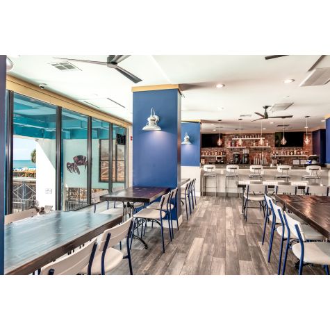 14” Laramie LED Sconce, 975-Galvanized, 1250 Lumen LED, 4000K-Cool White, Flat LED Lens (Also Pictured: Downtown Minimalist Cord Pendants in 705-Navy) | Photo Courtesy of IQ Designs