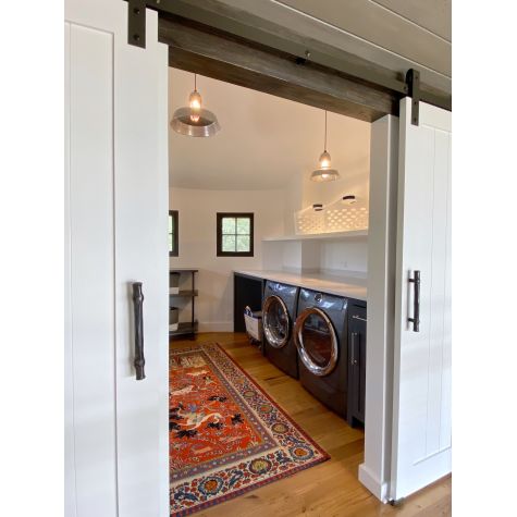 (2) Sydney LED Pendants, (1) 12” & (1) 18”, both in 975-Galvanized Shade, Both With Cap, Both with CSBB-Black & Brown Chevron Cloth Cord, 18” with 400-Barn Red Guard Finish, 12” with 975-Galvanized Guard Finish  | Photo Courtesy of Island Interiors LLC