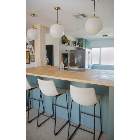 12” Glass Ball Pendant, Opaque Glass, 997-Raw Brass Top & Canopy, SBK-Standard Black Cord | Photo Courtesy of Jesse Bray (@jessbrayy)