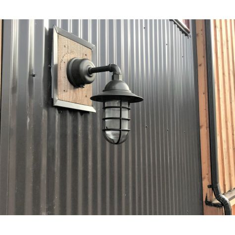 Industrial Guard LED Sconce, 600-Bronze, CGG-Standard Cast Guard in 615-Oil Rubbed Bronze, Ribbed Glass, Dusk-to-Dawn Photocell, 16W LED - 1600 Lumen, 2700K Color Temperature  | Photo Courtesy of Jay Nicolas @nicolasjay