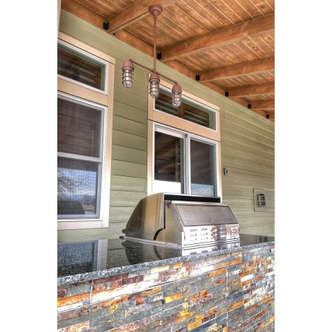 Alliance 3-Light Chandelier, 605-Rust, 24" Stem Hang Straight, CGG-Standard Cast Guard, 605-Rust, Clear Glass | Photo Courtesy of Homeowner