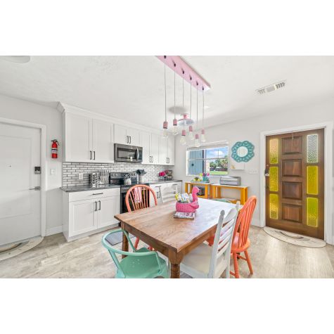 Downtown 6-Light Pendant Chandelier, 480-Blush Pink, Standard White Cord | Photo Courtesy of Southbound Stays