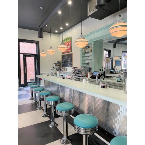 Primary Schoolhouse Pendant, Large Opaque Glass, 975-Galvanized, Triple Painted Band, 390-Teal, Standard Black Cord | Photo Courtesy of Livingston's Soda Fountain