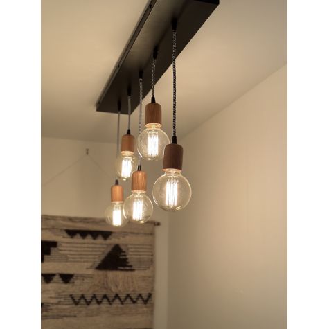 Downtown Minimalist Wooden Socket 5-Light Pendant, Oak, Black and White Cord, 106-Matte Black, G30 Bulb | Photo Courtesy of John Colenari